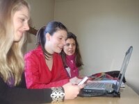 Girls learning together in front of a computer Girls learning together in front of a computer