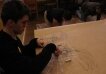 Lukasz while painting at an art therapy workshop